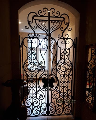 Openwork forged door grille