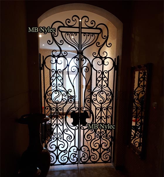 Openwork forged door grille